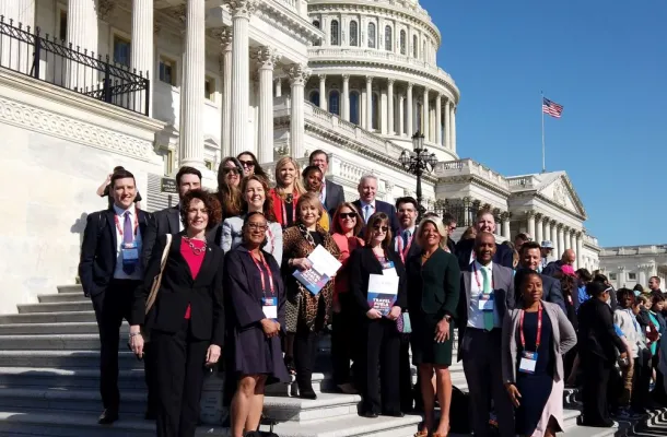 Photo of U.S. travel industry leaders on the steps of the U.S. Capitol.