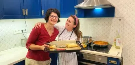 Learning to cook chicken paprikash from local chef, Brigi, in Budapest, Hungary