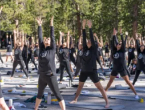 Attendees practice Yin Yoga at the 2024 Caesars Global Wellness Summit. Credit: Caesars Entertainment.