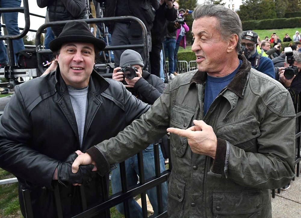 Mike Kunda and Sylvester Stallone shaking hands